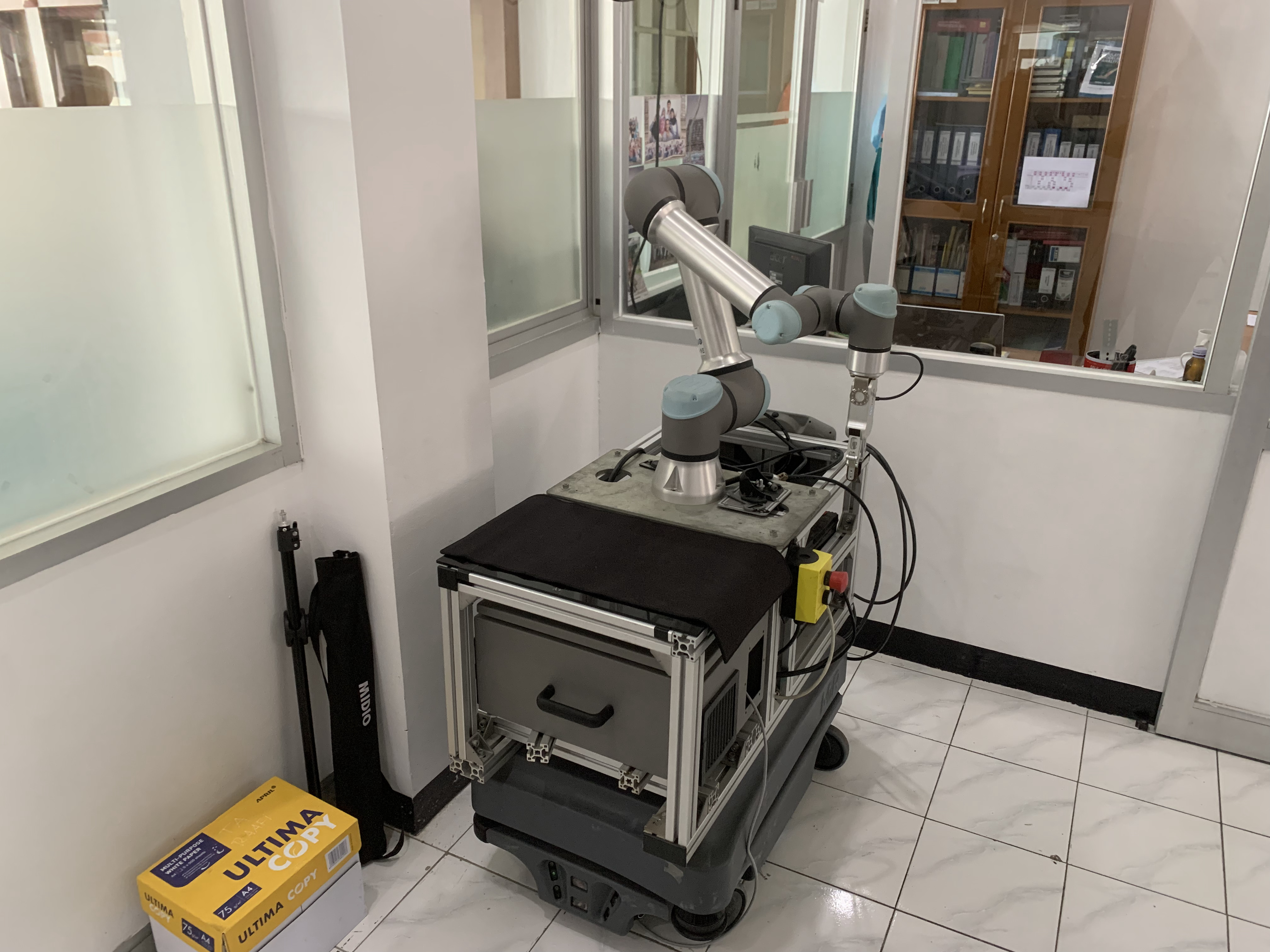 Universal Robots UR5e collaborative robot arm in a laboratory cell